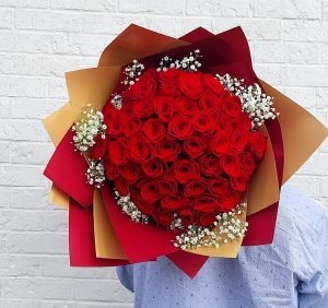 50 roses wrapped; fifty roses wrapped with paper