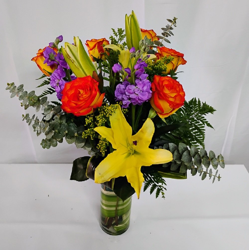 Miracle of love, high and magic roses, a lily stem and purple flowers.