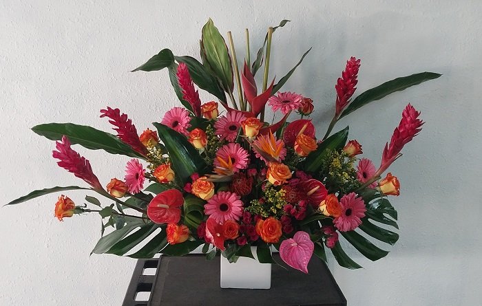 Tropical Party. Tropical and colorful flowers in a vase.