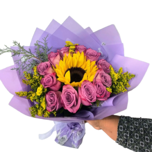12 purple roses and a sunflower in the center, wrapped bouquet.