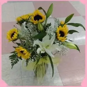 Seven sunflowers and lilies.