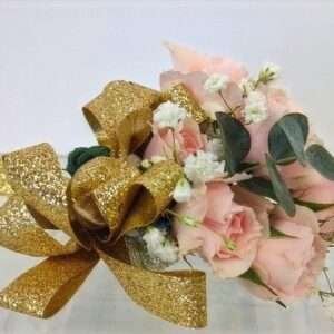 Pink and golden corsage