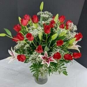 25 Roses plus lilies.