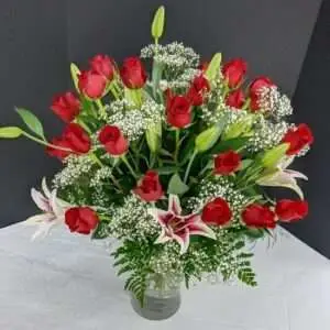 25 Roses plus lilies.