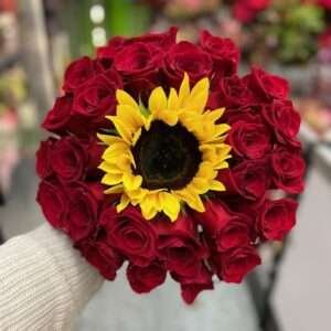 30 roses and a sunflower.