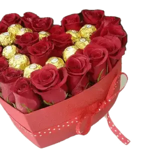 Heart shape box with roses and chocolates.